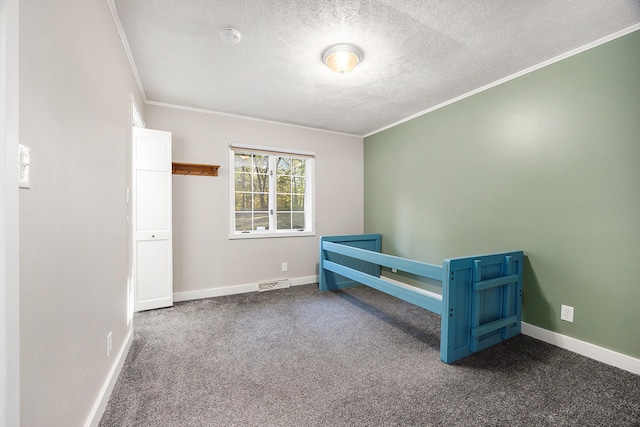 bedroom featuring dark colored carpet, ornamental molding, visible vents, and baseboards