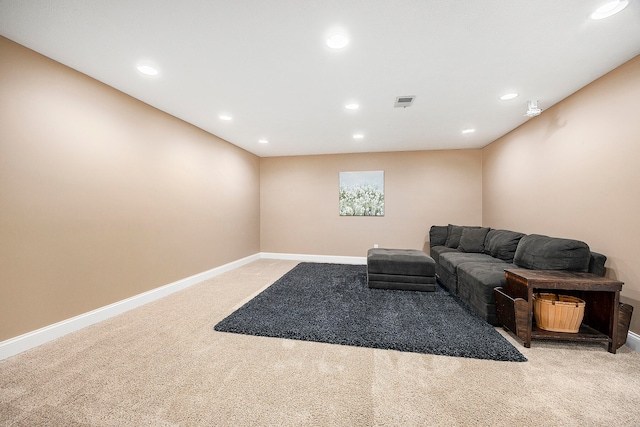 living area featuring light carpet, recessed lighting, and baseboards