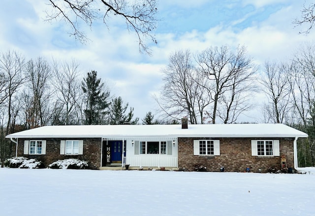 ranch-style house with crawl space, a chimney, and brick siding