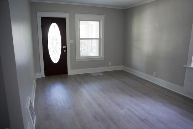 entryway featuring ornamental molding and hardwood / wood-style floors