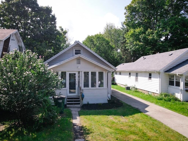 bungalow with a front yard