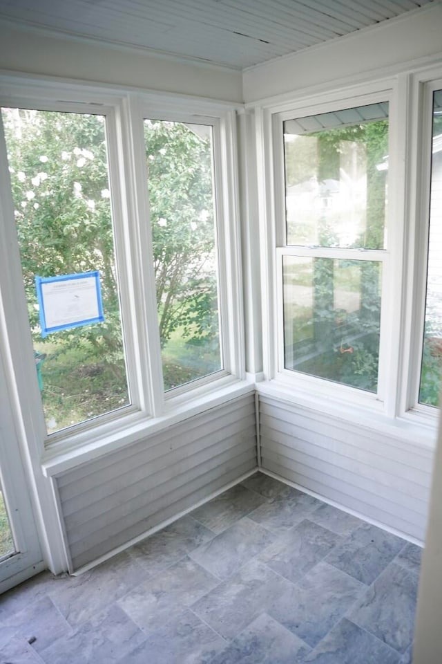 unfurnished sunroom with a wealth of natural light