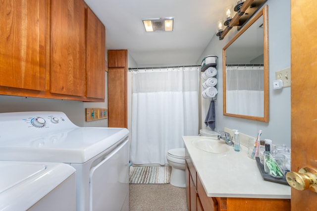 clothes washing area featuring sink and washing machine and clothes dryer