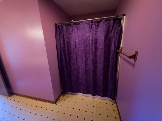 bathroom with a shower with shower curtain