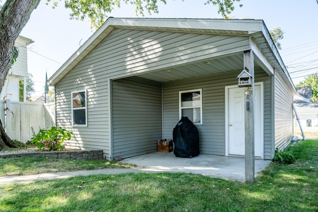 back of property with a yard