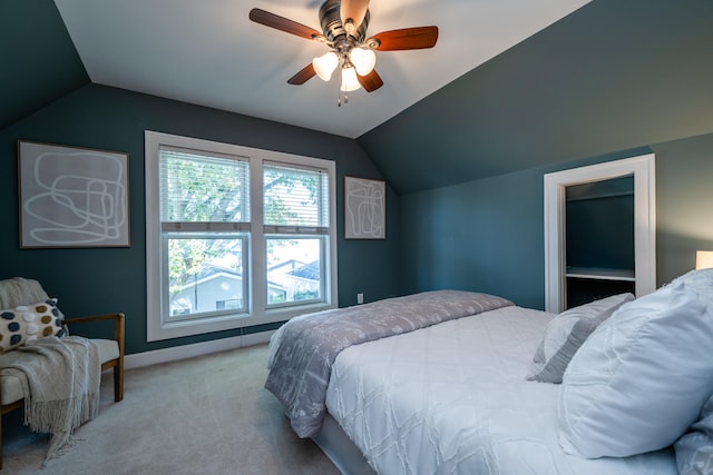 bedroom featuring light carpet, ceiling fan, and vaulted ceiling