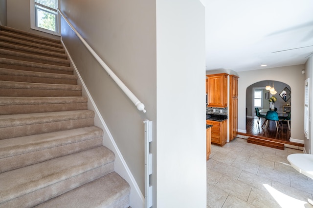 stairs featuring wood-type flooring