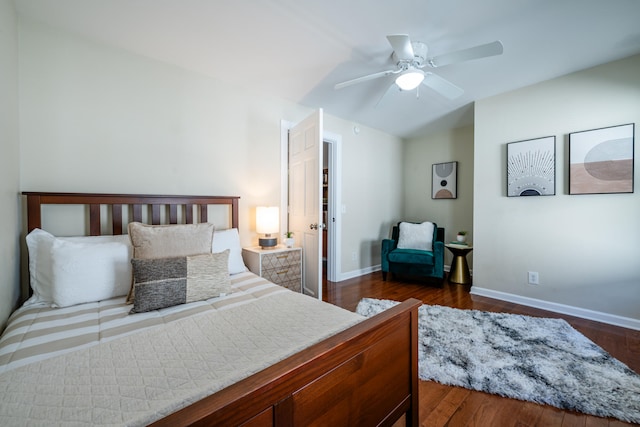 bedroom with ceiling fan and dark hardwood / wood-style flooring