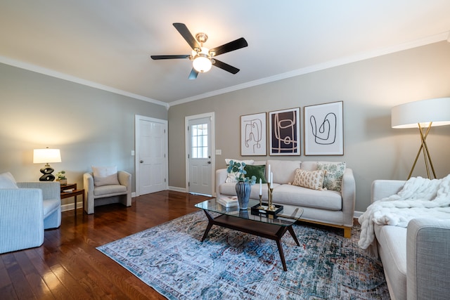 living room with crown molding, ceiling fan, and dark hardwood / wood-style flooring