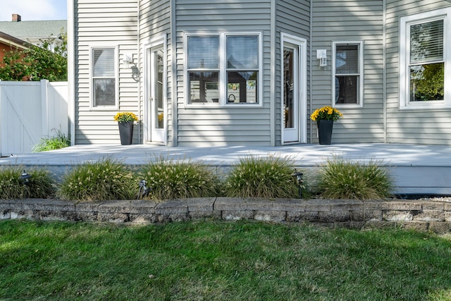 doorway to property featuring a yard