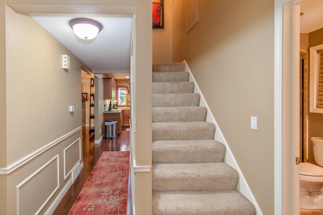 staircase featuring hardwood / wood-style flooring