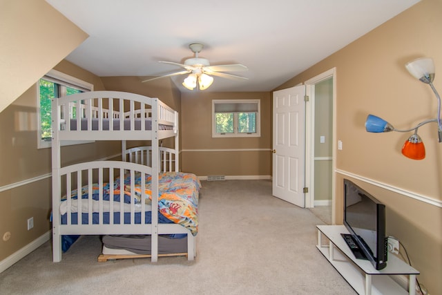 bedroom featuring ceiling fan and light colored carpet