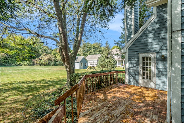 wooden terrace with a yard