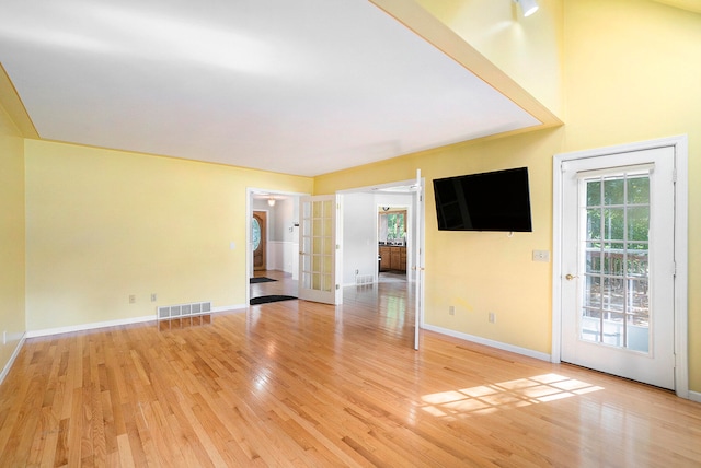 spare room with hardwood / wood-style floors