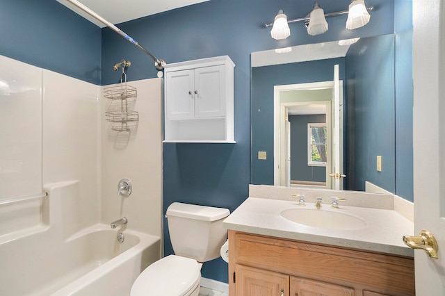 full bathroom featuring tub / shower combination, vanity, and toilet