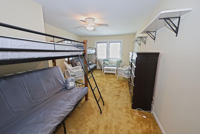 bedroom featuring light carpet and ceiling fan