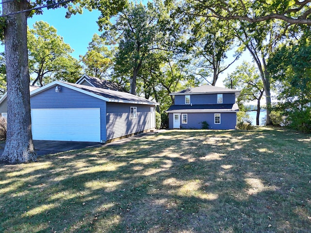 exterior space with a garage and an outdoor structure