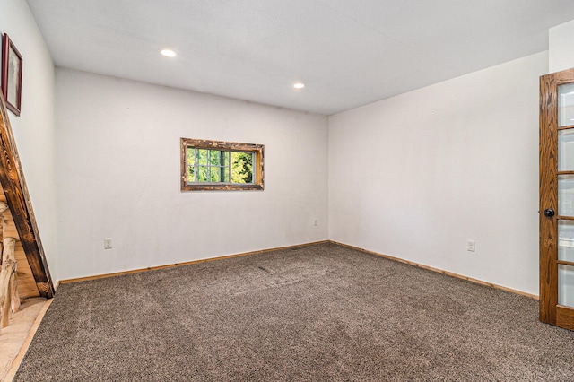 unfurnished room featuring carpet flooring