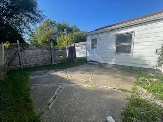 view of side of home featuring a patio