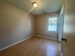 empty room with light wood-type flooring