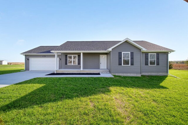 ranch-style house with a garage and a front lawn