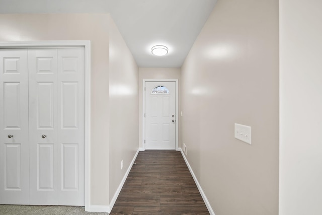 doorway with dark wood-type flooring