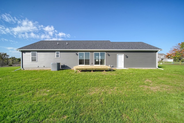 back of house with a lawn, a deck, and central air condition unit