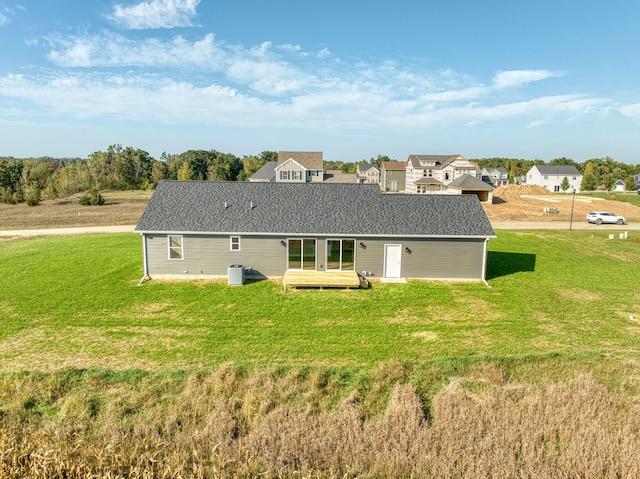 back of property featuring a lawn and a patio