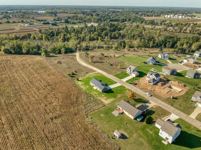 birds eye view of property with a rural view