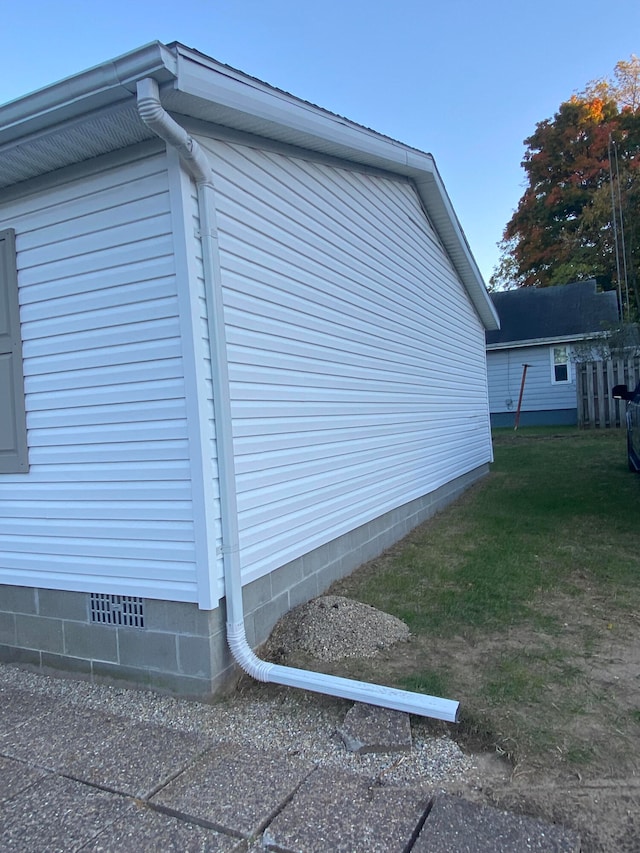 view of home's exterior featuring a lawn