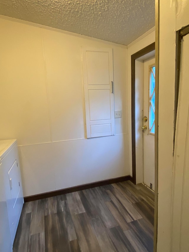 washroom featuring washer and clothes dryer, a textured ceiling, and dark hardwood / wood-style flooring