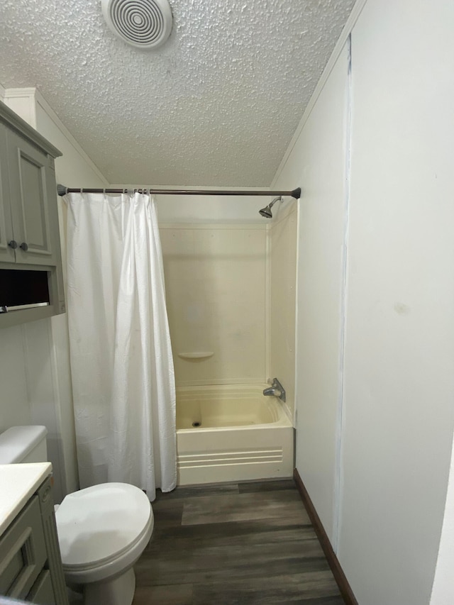 full bathroom featuring vanity, a textured ceiling, toilet, and wood-type flooring