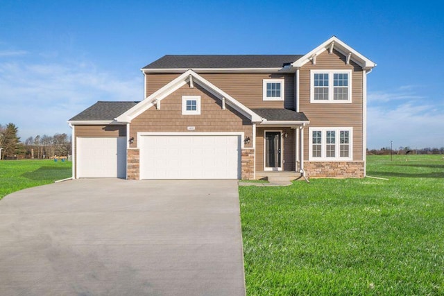 craftsman inspired home featuring stone siding, an attached garage, driveway, and a front lawn