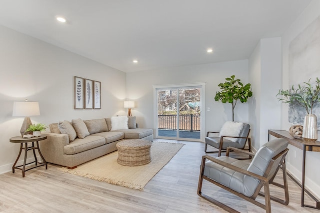 living room with light hardwood / wood-style flooring