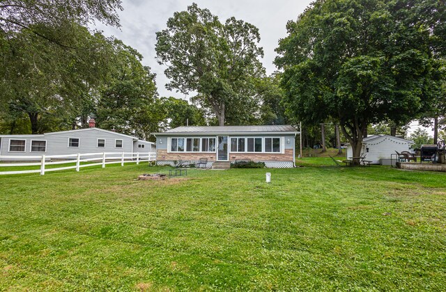 view of front of home with a front lawn