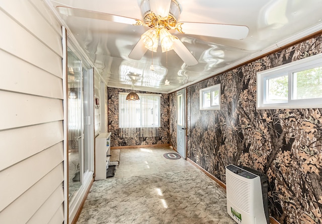 bathroom with ceiling fan and crown molding