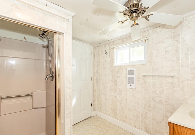 bathroom with walk in shower, vanity, and ceiling fan