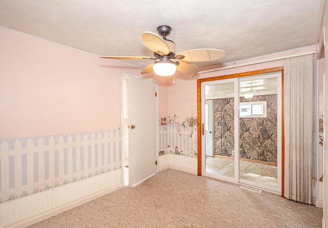 empty room featuring ceiling fan and carpet floors