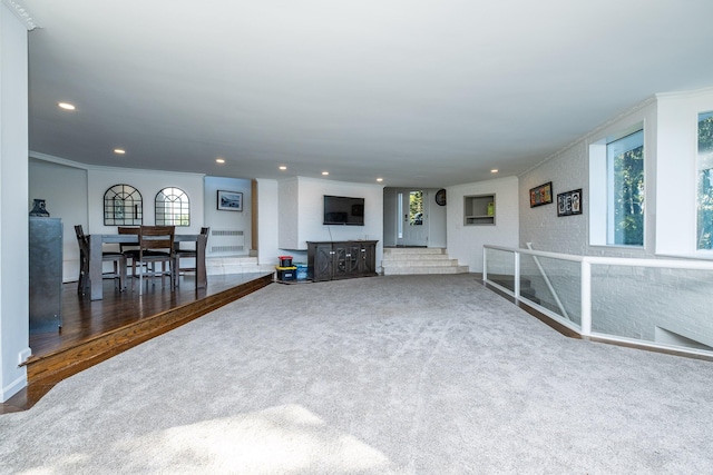 living room with ornamental molding and hardwood / wood-style floors