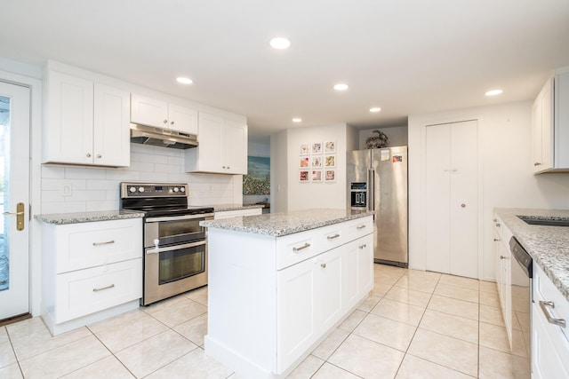 kitchen with white cabinetry, appliances with stainless steel finishes, and a kitchen island