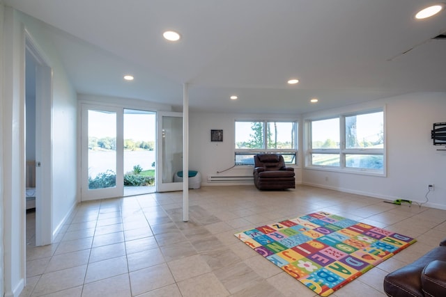 recreation room featuring baseboard heating and light tile patterned floors