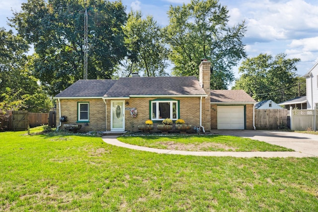 ranch-style house featuring a front yard and a garage