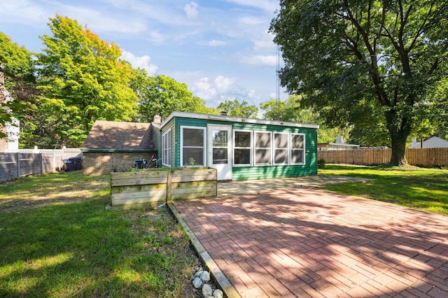 wooden deck featuring a lawn and a patio area