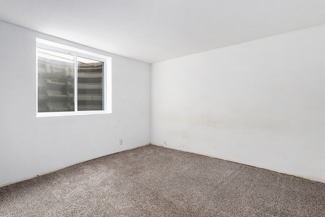 empty room with carpet flooring and plenty of natural light