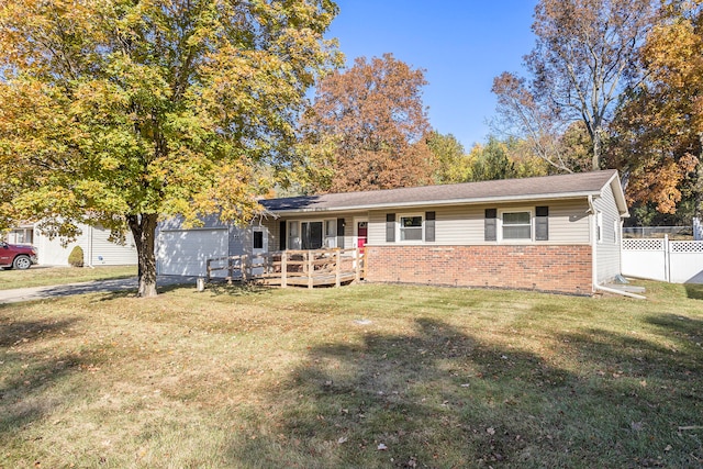 ranch-style house with a front lawn and a deck