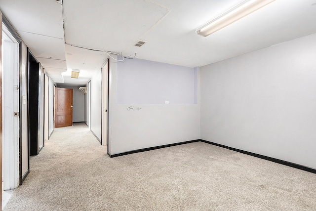 spare room with light colored carpet