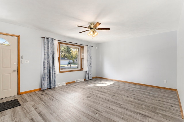 entrance foyer featuring light hardwood / wood-style flooring and ceiling fan