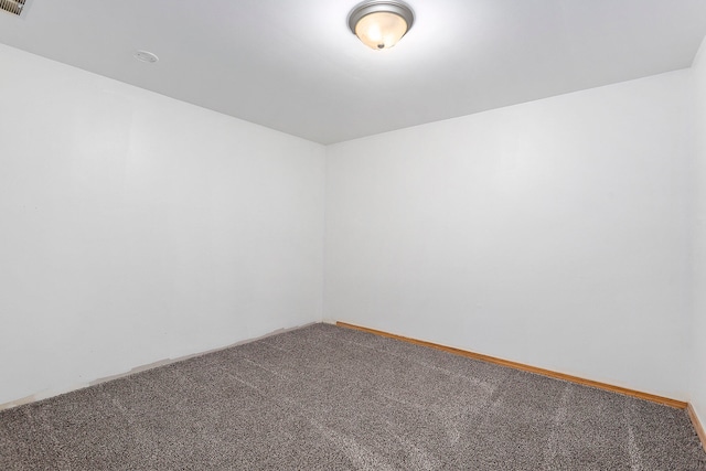 spare room featuring carpet