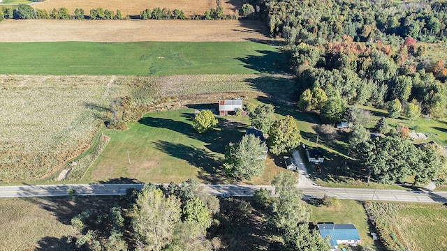 birds eye view of property with a rural view