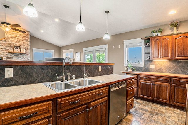 kitchen featuring pendant lighting, dishwasher, tasteful backsplash, and sink